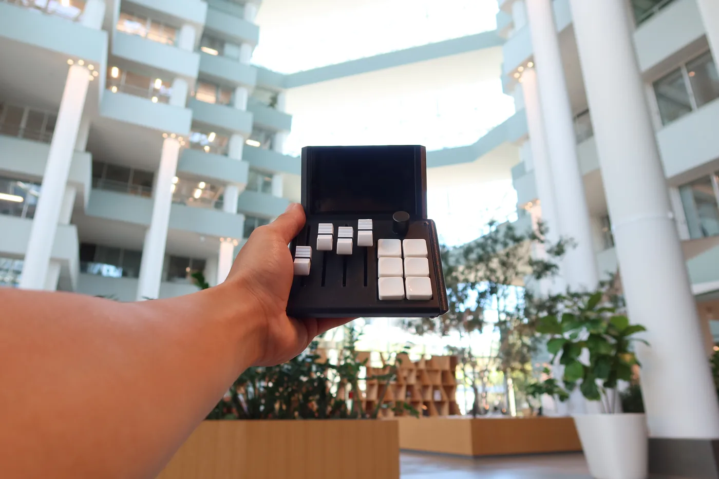 Mixlar M1X held up inside a building atrium