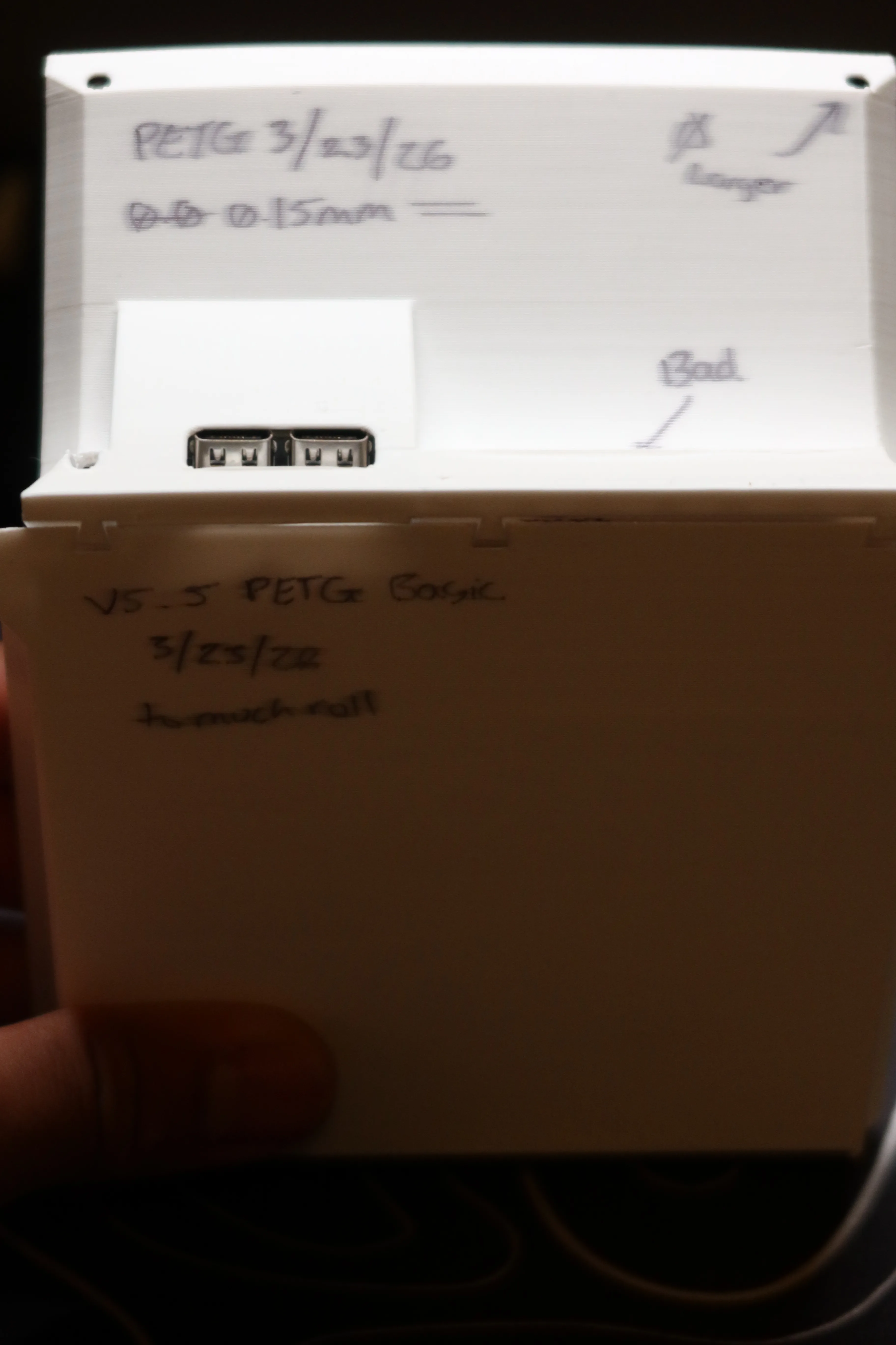 Early PETG prototype with handwritten notes and iteration dates